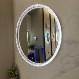 Illuminated mirror with crystal.