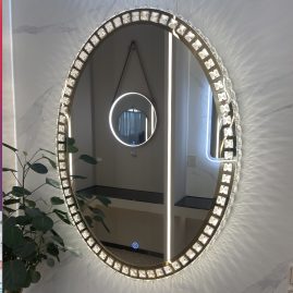 Illuminated mirror with crystal.